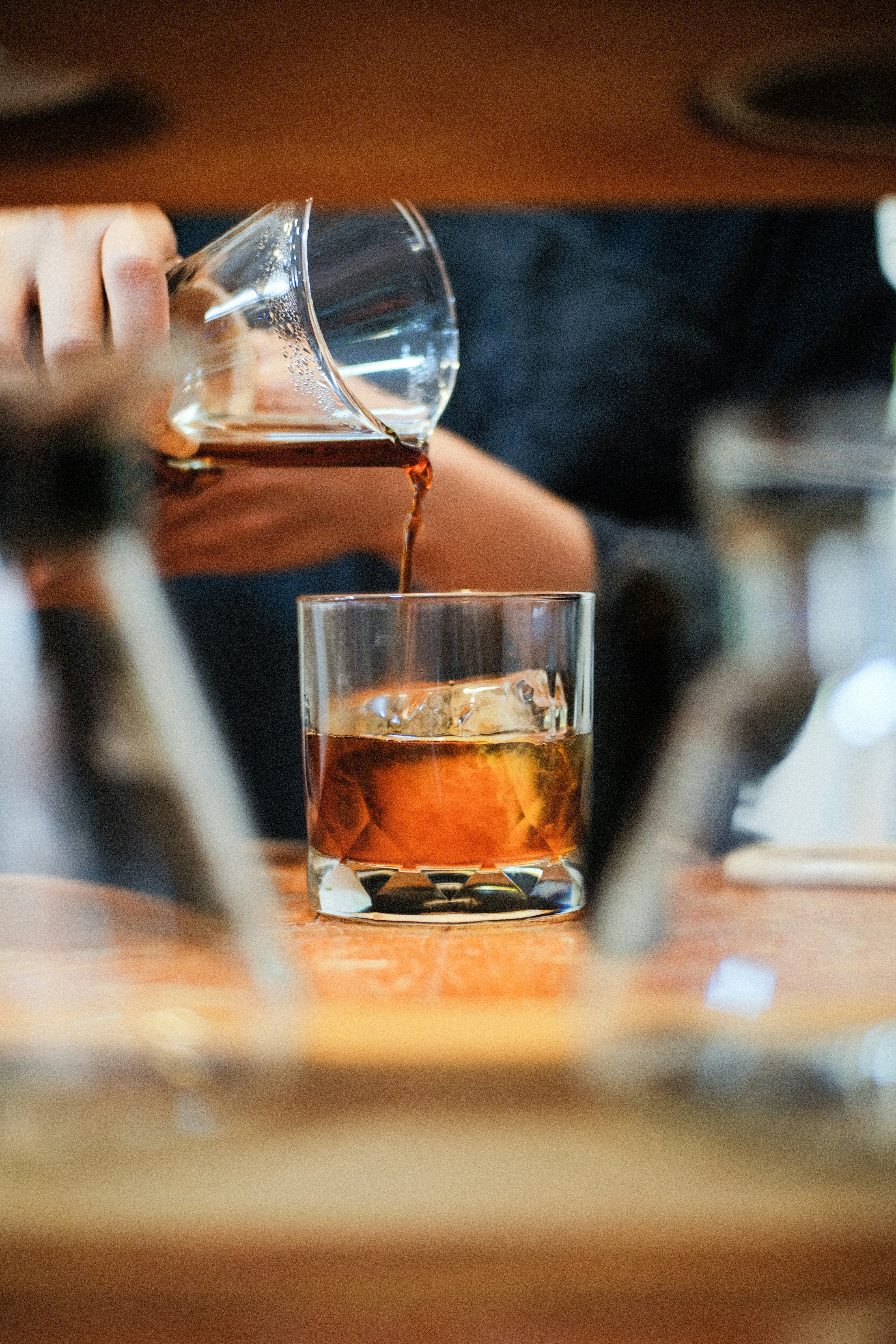 clear drinking glass with brown liquid